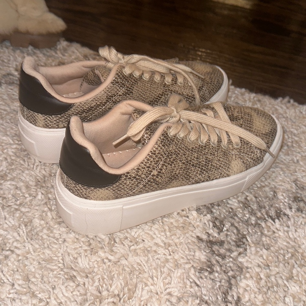 Platform snake skin tennis shoe. Never worn